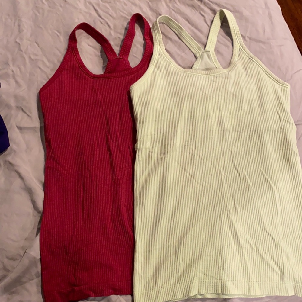 Two built in-bra Lululemon workout tanks.